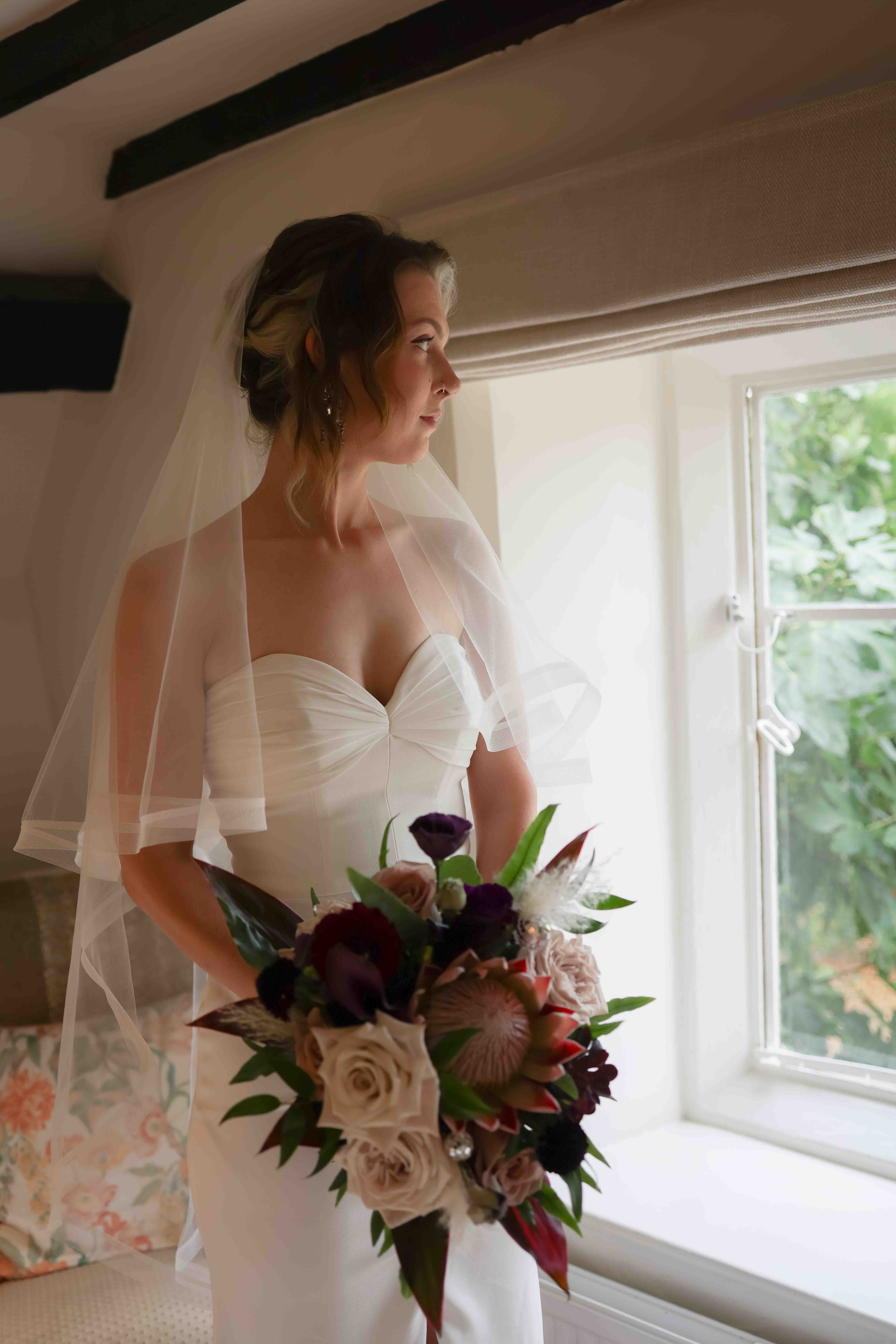 Bride photographed by Ruby Salmon Photography at Worton Hall in Oxfordshire